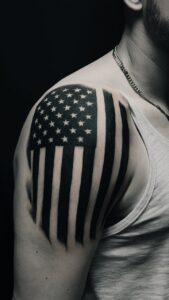 American flag shoulder tattoos men American flag shoulder tattoos male American flag tattoo black and white American flag shoulder tattoos for guys American flag shoulder tattoos meaning American flag tattoos