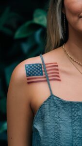 American flag shoulder tattoos men American flag shoulder tattoos male American flag tattoo black and white American flag shoulder tattoos for guys American flag shoulder tattoos meaning American flag tattoos